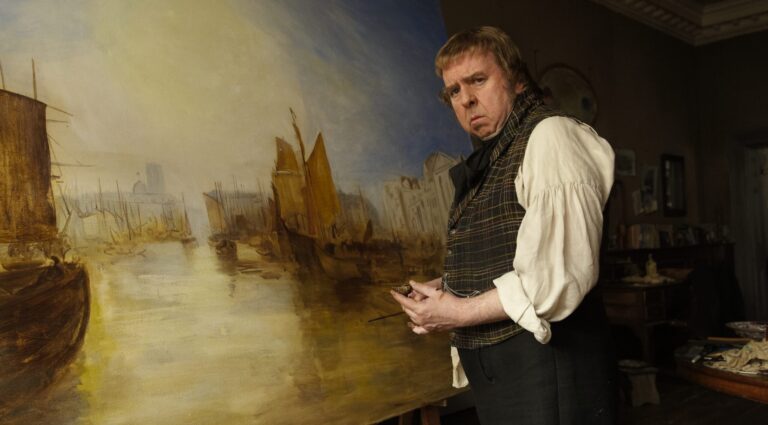 Timothy Spall as Mr. Turner painting a maritime scene.