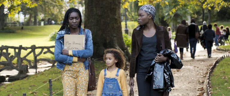 Three characters from "My Friend Victoria" walking in a park. Sign reads "Mon amie Victoria.