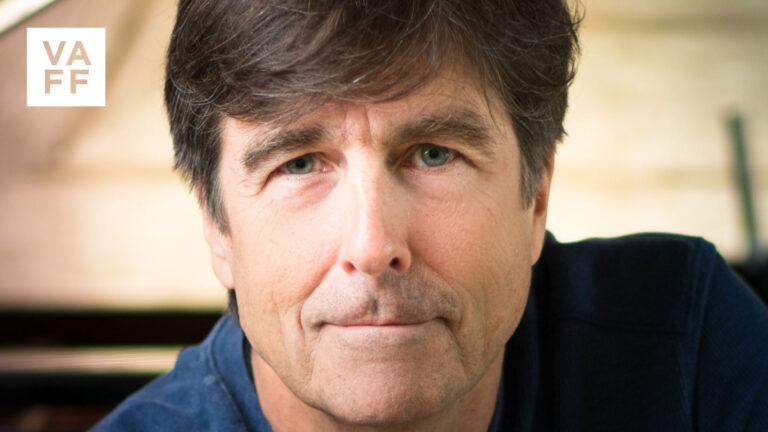 Close-up portrait of composer Thomas Newman, featured in a tribute article.