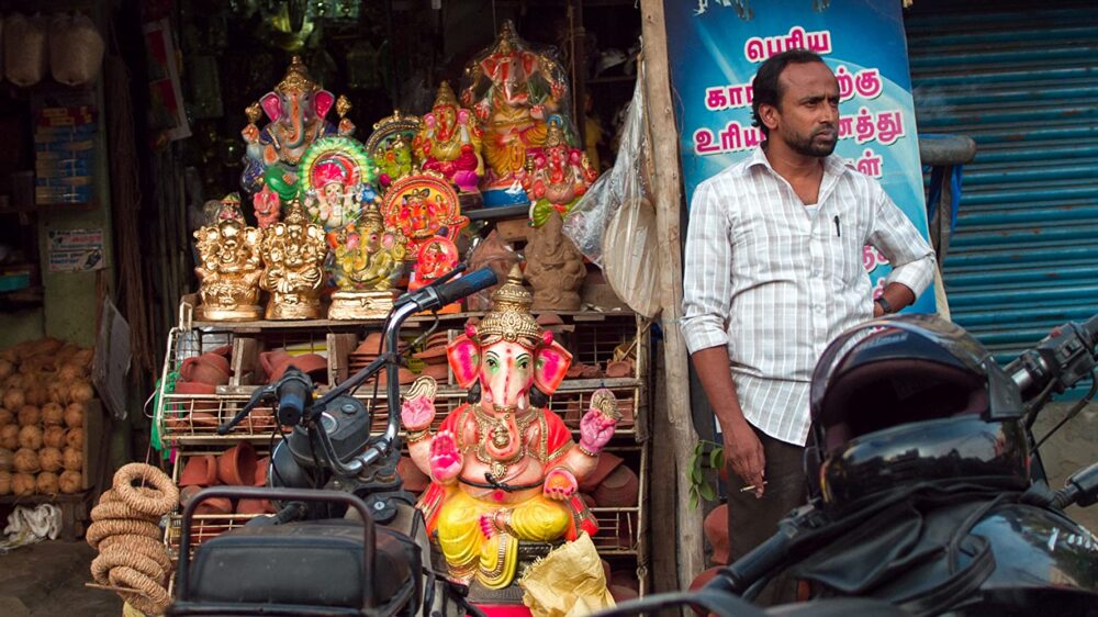 Ganesh statues for sale at a roadside shop in India.