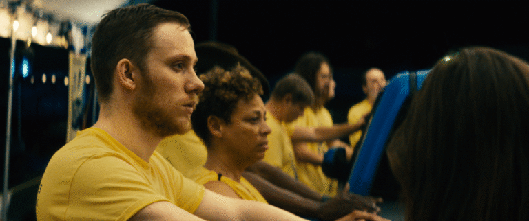 People in yellow shirts compete in "One of These Days" contest