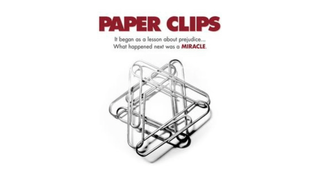 Paper Clips movie poster featuring intertwined paperclips and the tagline about prejudice and a miracle.