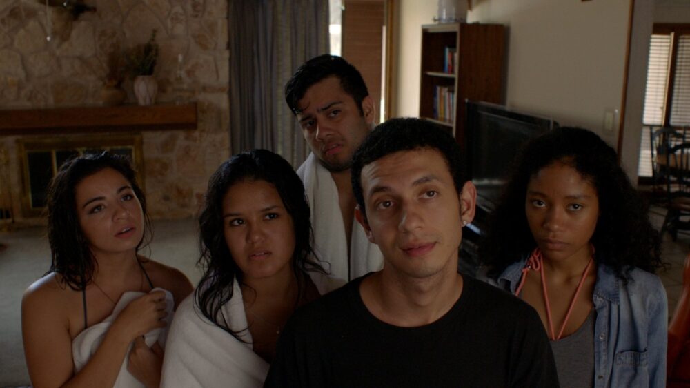 Group of young adults looking up.