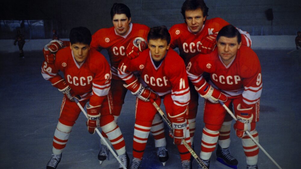 Soviet Red Army hockey team players in red jerseys with CCCP on ice.