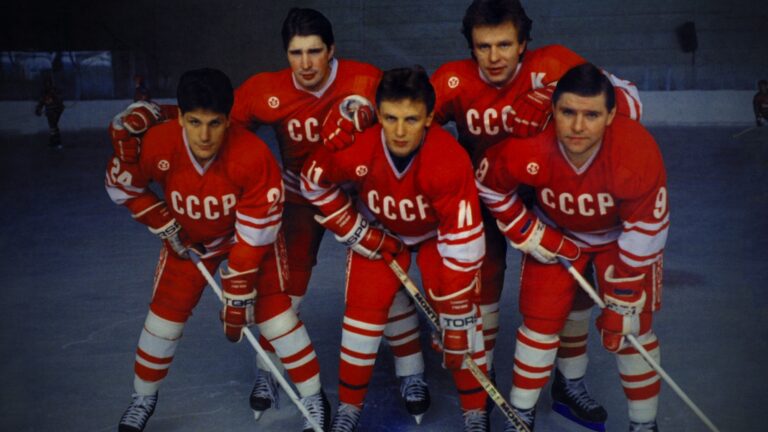 Soviet Red Army hockey team players in red jerseys with CCCP on ice.