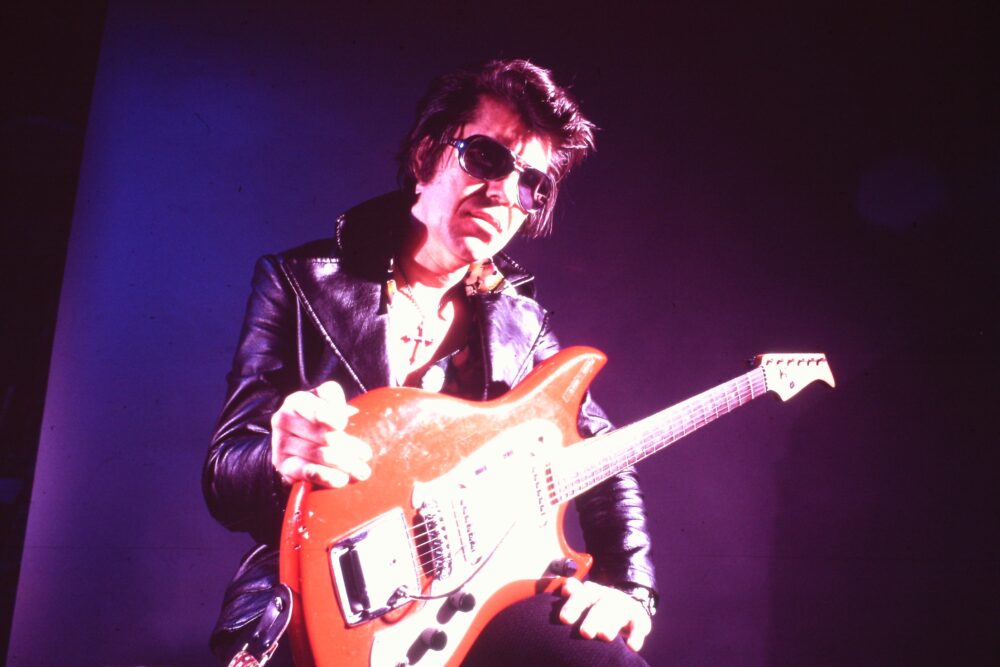 Link Wray with guitar, "Rumble: the Indians Who Rocked the World