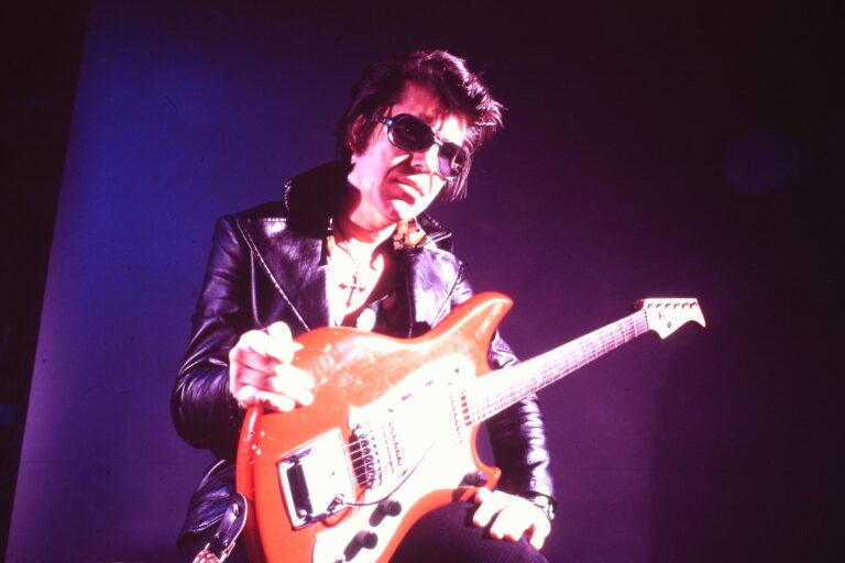 Link Wray with guitar, "Rumble: the Indians Who Rocked the World