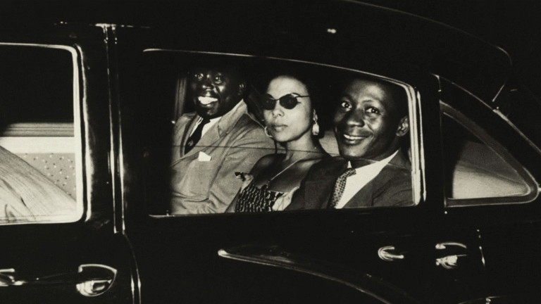 Patrice Lumumba and companions in a car, likely during the "Soundtrack to a Coup D'etat" period.