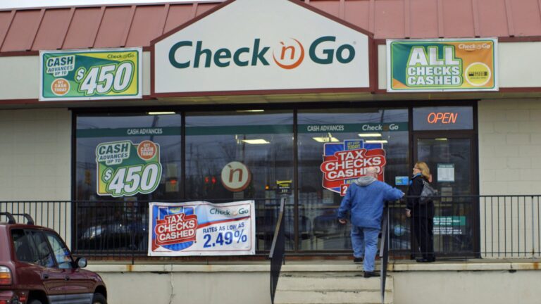 Check n Go storefront with signs for cash advances and tax check cashing.