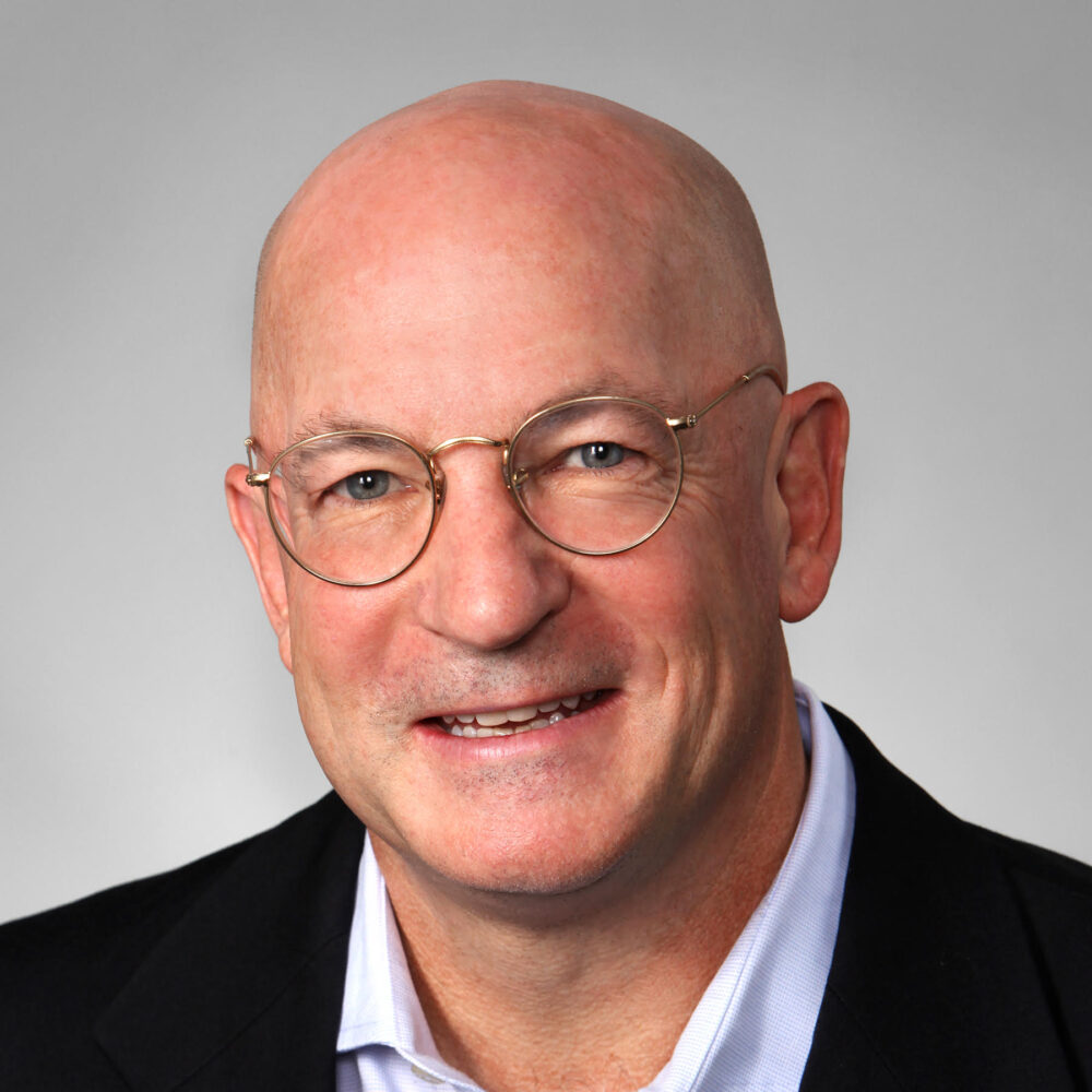 Temple W. Fennell Jr. wearing glasses and a suit jacket.