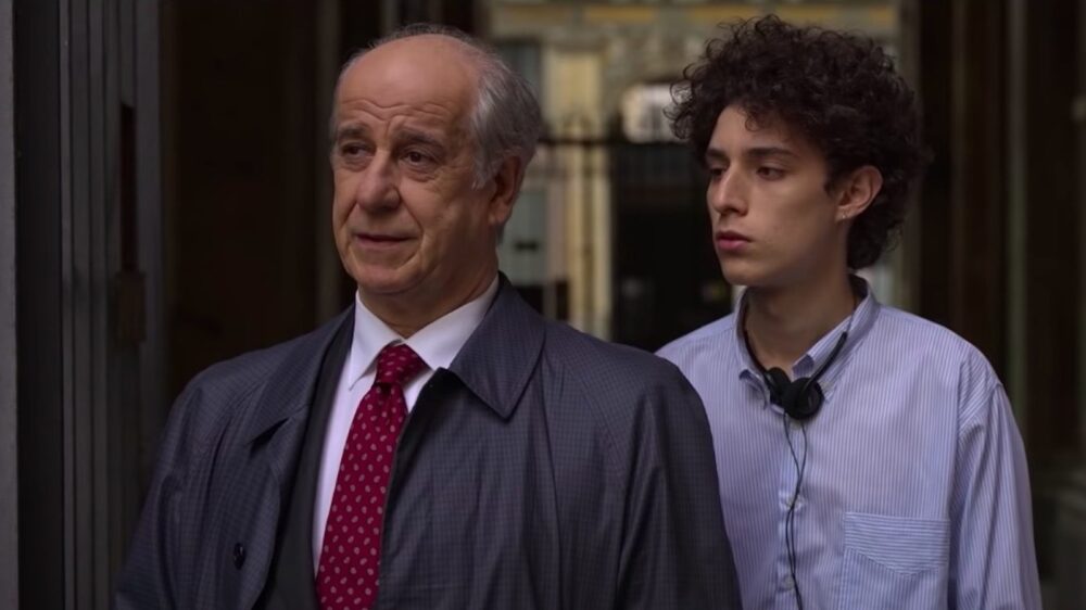Actor Toni Servillo with a young man in "The Hand of God" film.