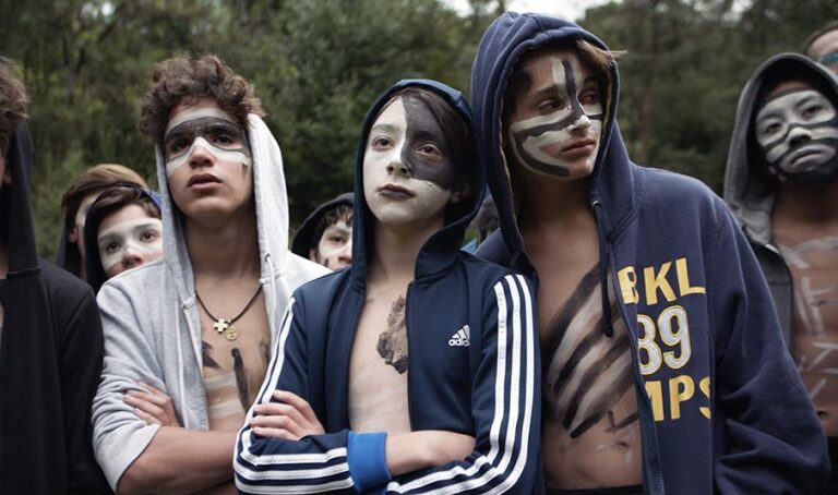 Boys with face paint in "The Hole in the Fence" film.