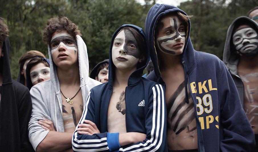 Boys with face paint in "The Hole in the Fence" film.