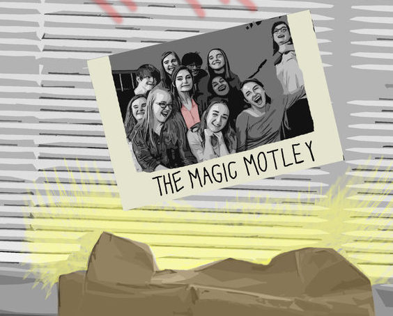 The Magic Motley group photo on a wall.