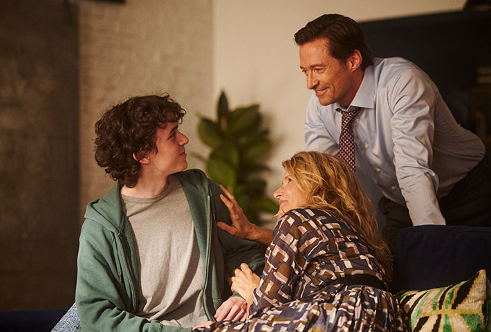 Hugh Jackman, Laura Dern, and Zen McGrath in "The Son" movie, family scene on a couch.