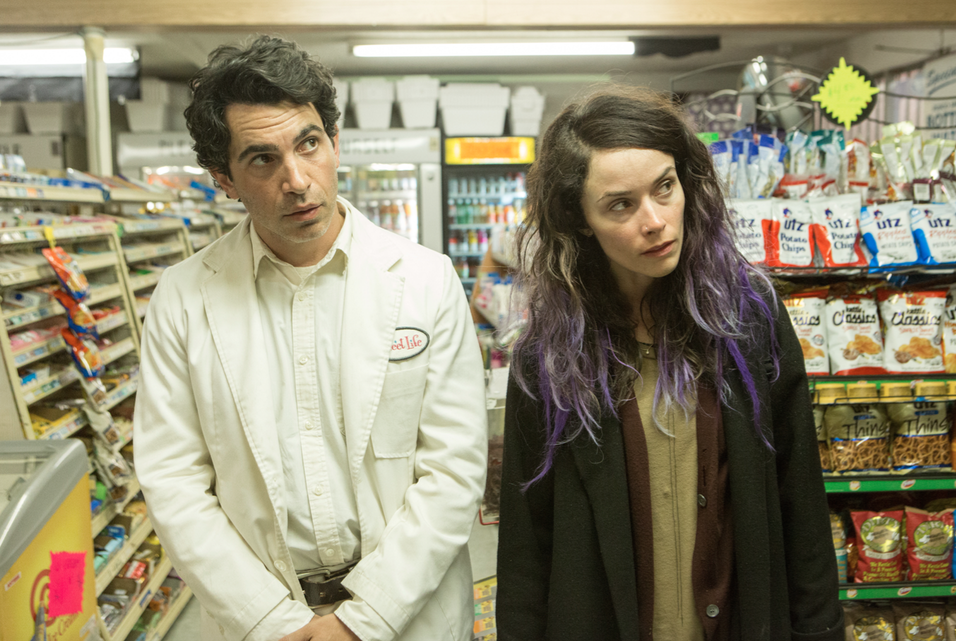 Man and woman in a convenience store.