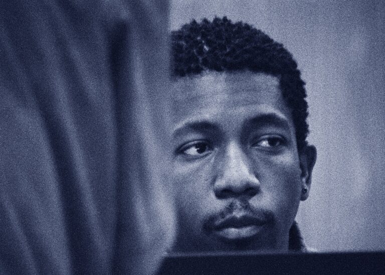 Close up of a man in Tonsler Park looking off to the side.