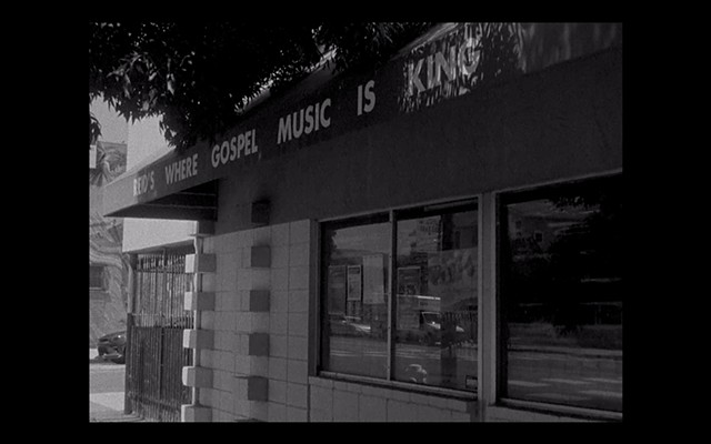 Exterior of Reid's Records; sign reads "Reid's Where Gospel Music Is King