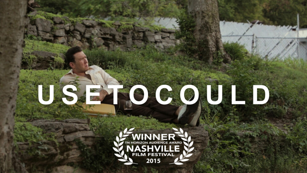 Usetocould film poster: Man reclining on rocks, Nashville Film Festival winner.