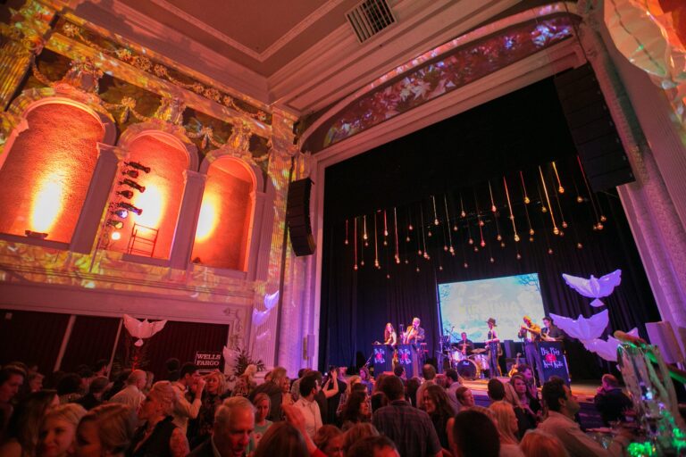 Gala event with band performing on stage and attendees