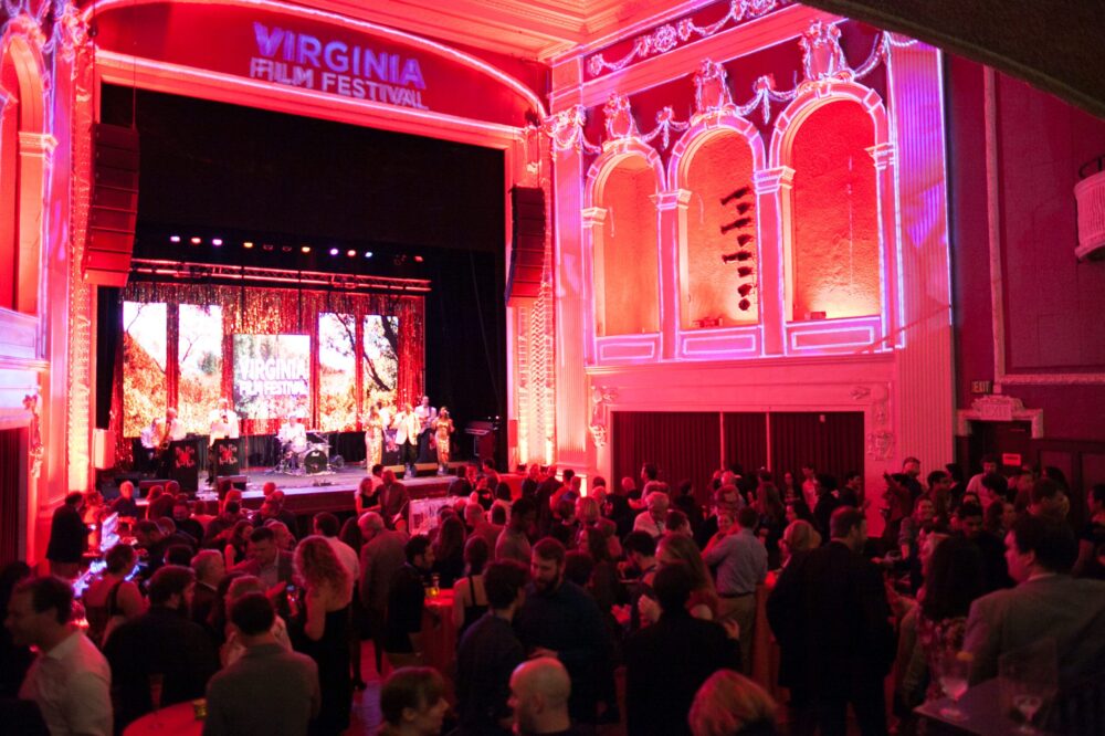 Virginia Film Festival opening night gala with a band performing on stage for a large crowd.