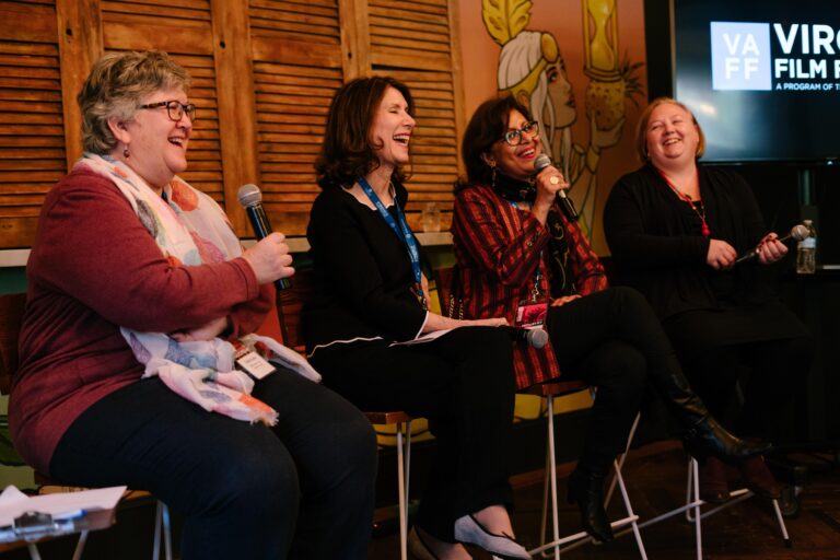 Panel of UVA professors discussing new cinema books, laughing with microphones.