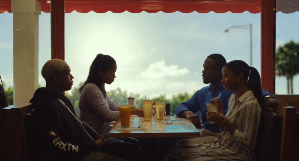 Family at a diner table, enjoying drinks and conversation.