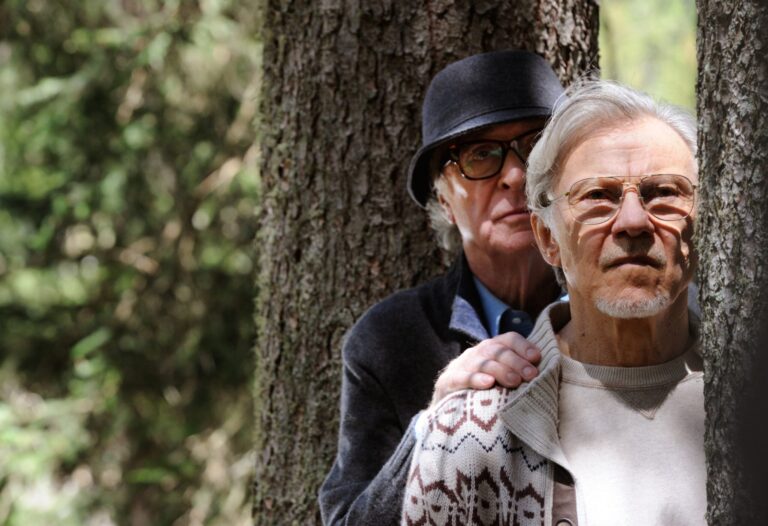 Michael Caine and Harvey Keitel in "Youth" movie scene by tree.