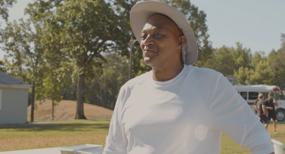 Man in hat outdoors, possibly related to "A Bridge to Life" program.