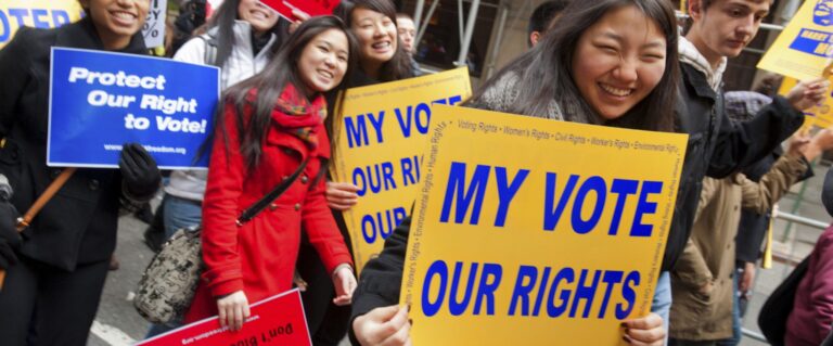 Democracy rally: People hold "My Vote, Our Rights" and "Protect Our Right to Vote!" signs.