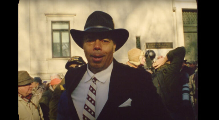 Man in hat and suit at Richmond, VA, January 13th event.