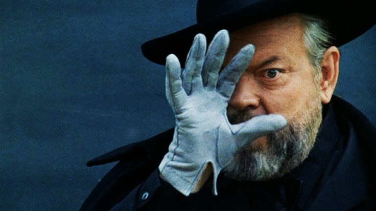 Orson Welles in "F for Fake" wearing glove and hat