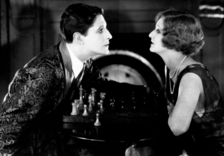 Alfred Hitchcock's "The Lodger" film still featuring Ivor Novello and June Tripp at a chessboard.