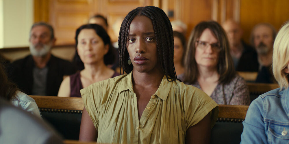 Rama faces the court in "Saint Omer" with a somber expression.
