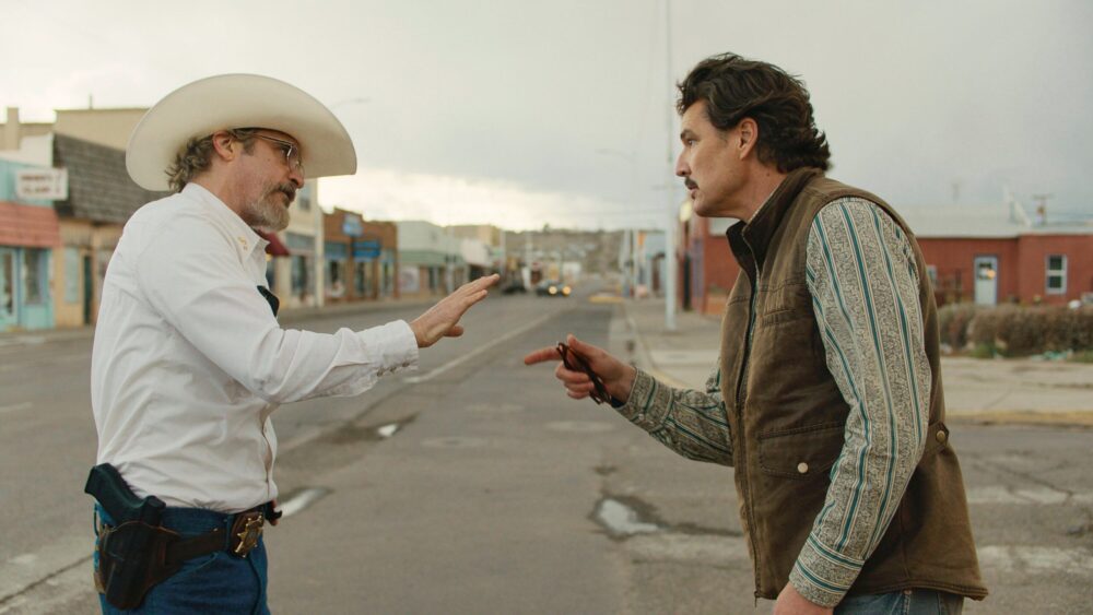 Joaquin Phoenix and Clifton Collins Jr. in "Eddington" face off.