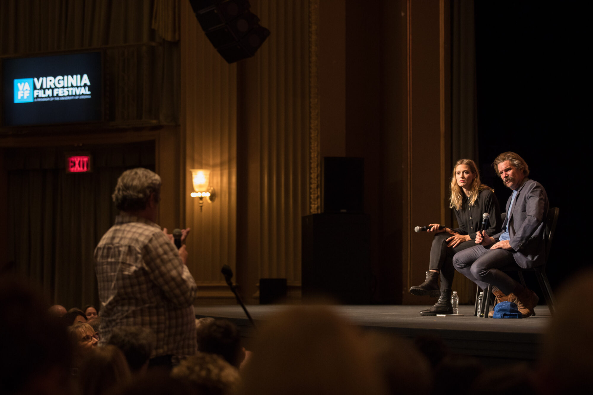 Virginia Film Festival event: Woman and man on stage, audience watching.