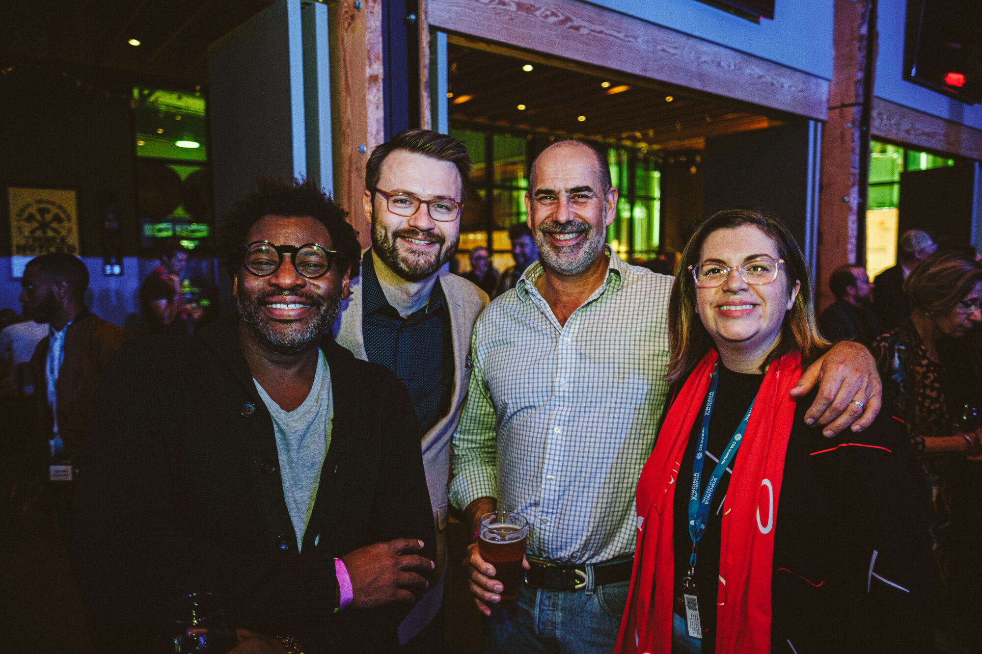 Group of four smiling people at NEA 2021 event.