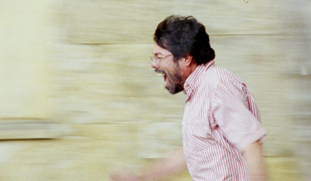 Man in motion, yelling. The image could be used for a blog post titled "A Poet.