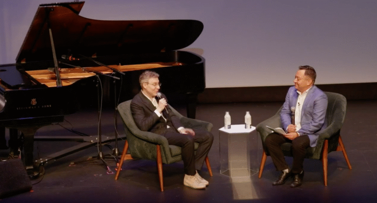 Panel discussion at the Virginia Film Festival with piano on stage.