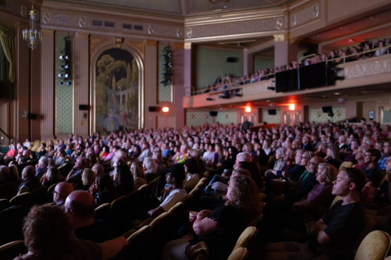 Audience watching a film in the Paramount Theater.